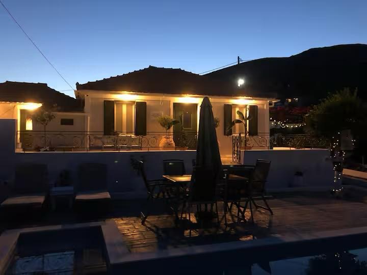 Villa at dusk with warm lighting