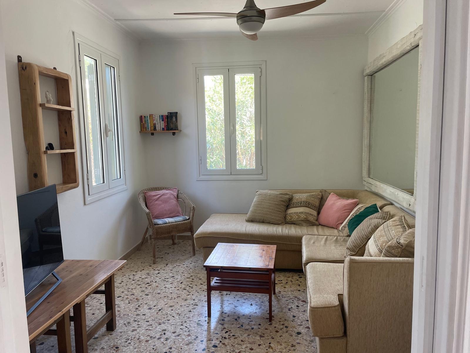 Living room with sofa and ceiling fan